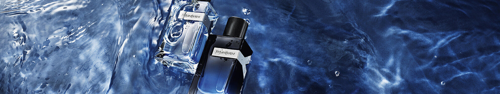 Two stylish perfume bottles are partially submerged in water, surrounded by splashes and ripples, creating a fresh and invigorating atmosphere.