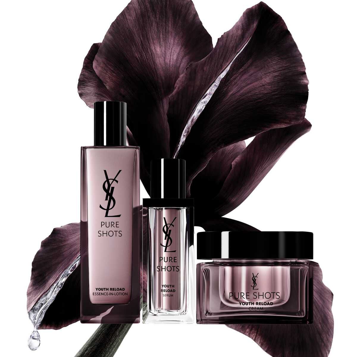 YSL Pure Shots Hautpflegeprodukte vor einem dunklen Blumenhintergrund.