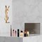 YSL Beauty-Set mit Miniprodukten und Kosmetiktasche.
