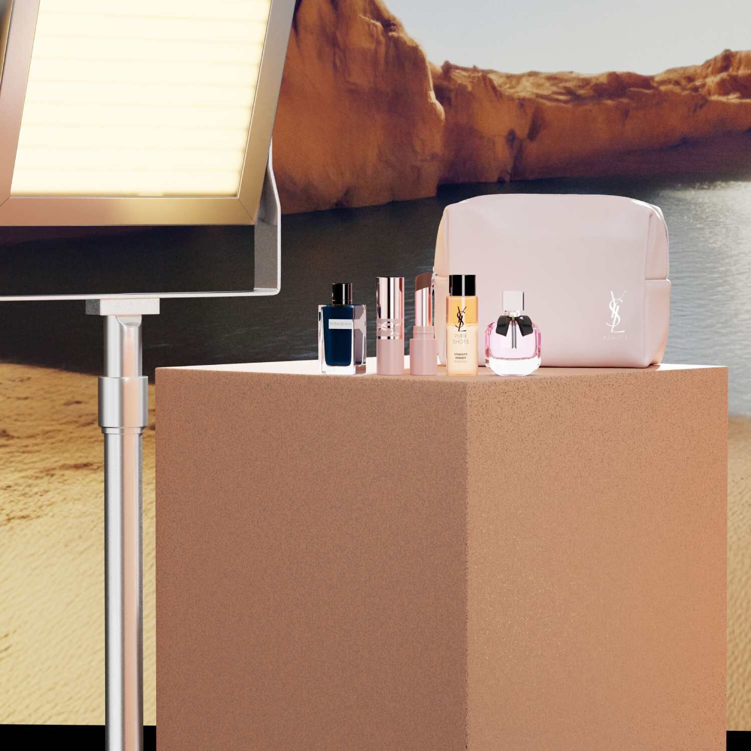 YSL Beauty-Set mit Miniprodukten und weißer Kosmetiktasche.