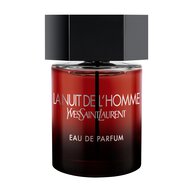 The Bottle front-facing shot of the La Nuit de l’Homme Eau de Parfum bottle, featuring a deep red-to-black gradient glass and a signature matte black hexagonal cap.
